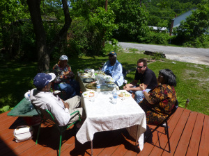 Folks gathered on the porch for food and conversation 